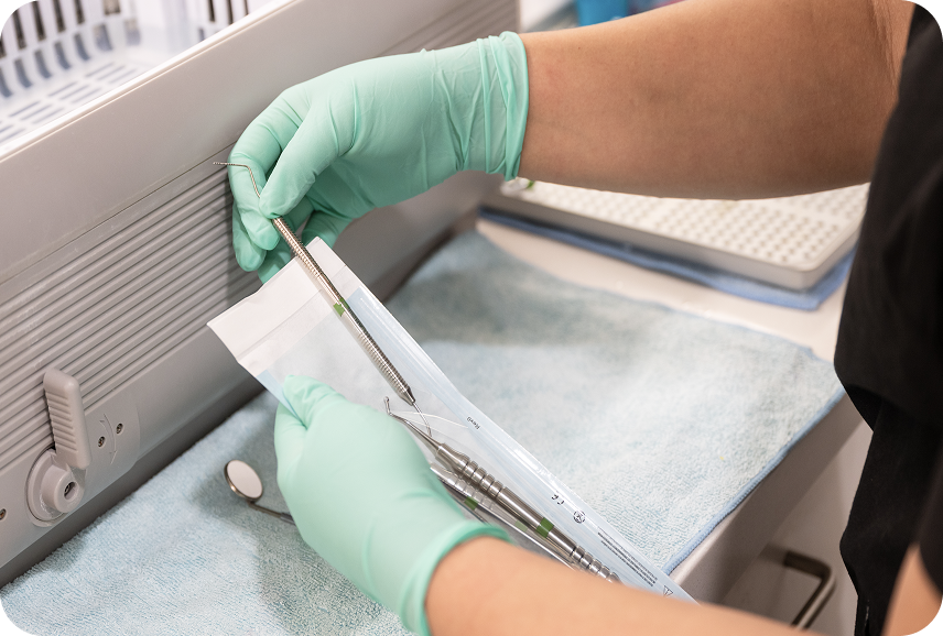 Dentist holding the dental tools